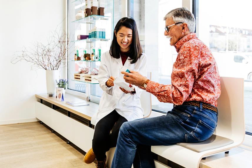 Man talking to pharmacist