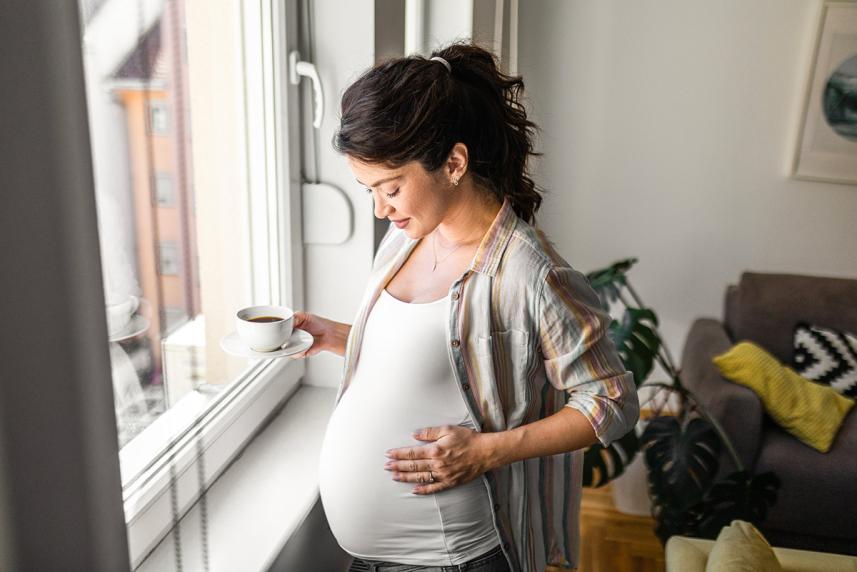 Woman holding her pregnant stomach