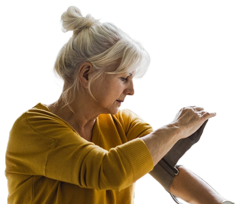 A women putting a blood pressures testing cuff around her upper arm. 