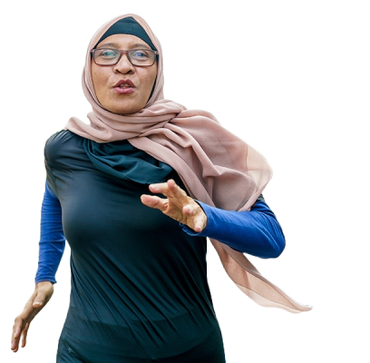 An atheletic women wearing a hijab running in a street with others in the background doing various outdoor activities.