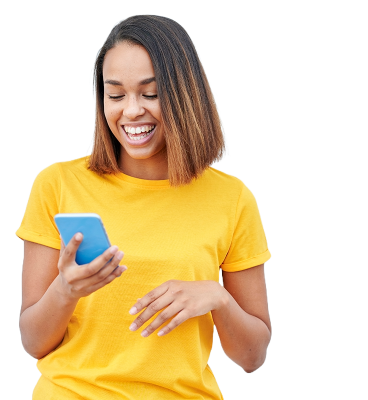 A smiling women looking at her phone. She is wearing a very bright yellow shirt.