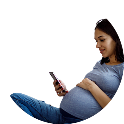 An expecting person looking at their phone