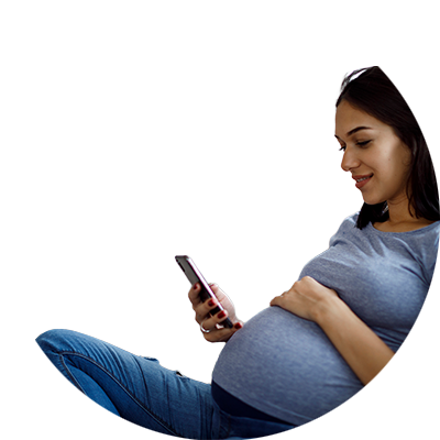 An expecting person looking at their phone