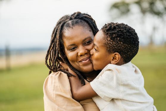 Mother and son hugging