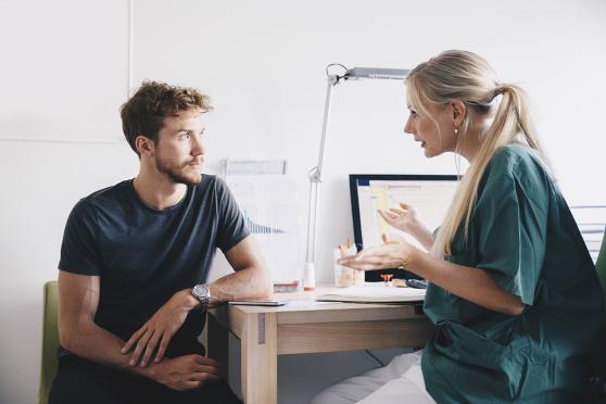 Nurse talking to man