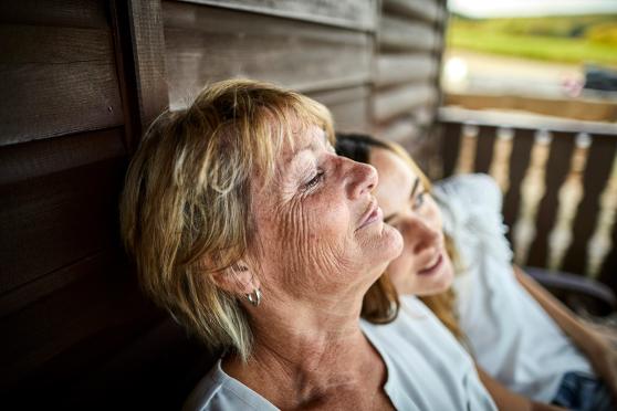 Women relaxing sitting outside